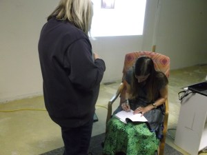 Signing a book at the book reading